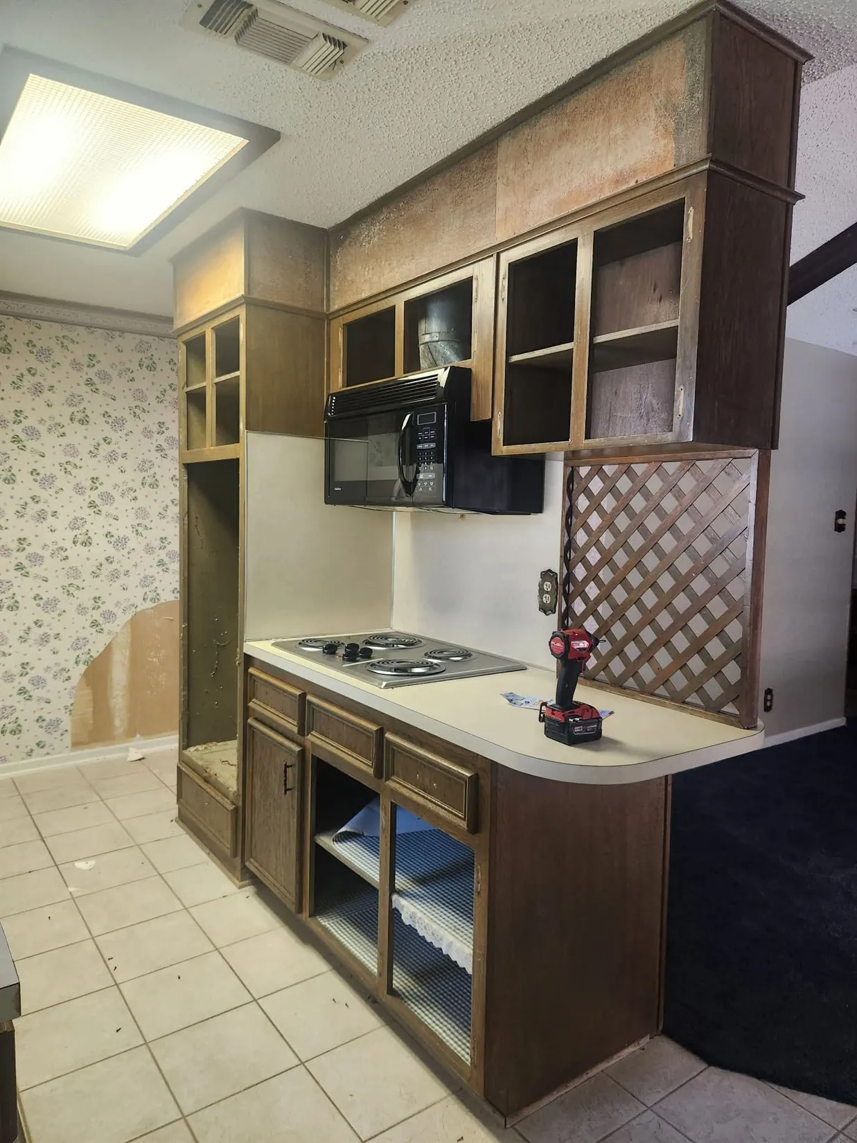 Same kitchen before cabinetry refinishing